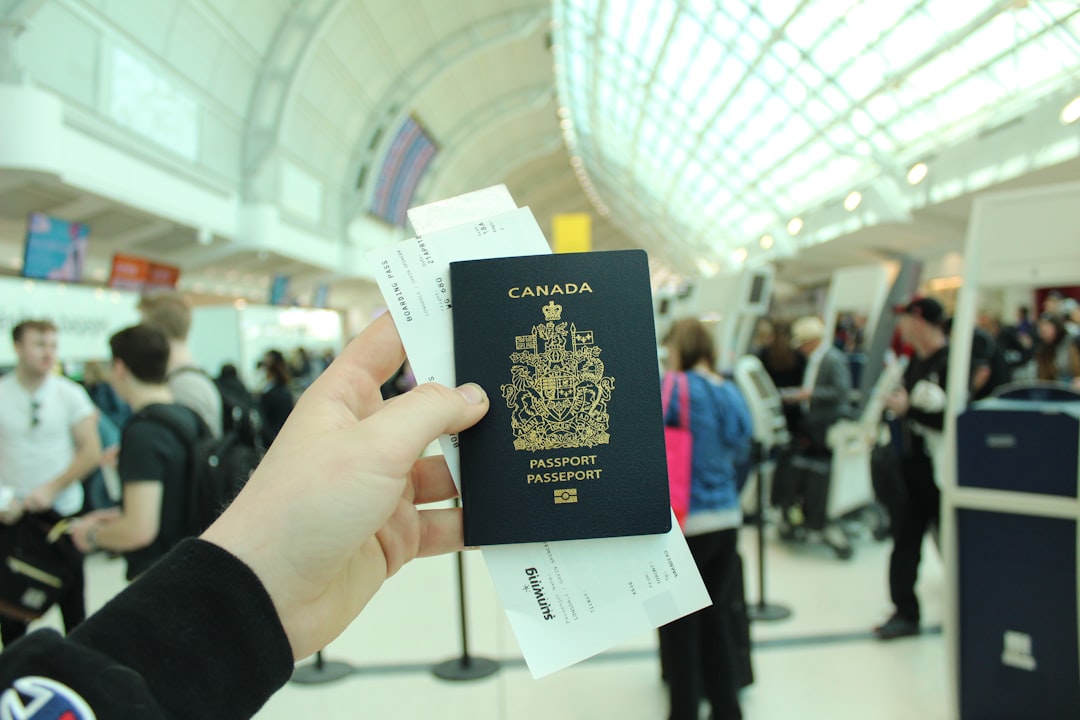 Person holding a Canadian passport — Express Entry CRS score analysis 2026