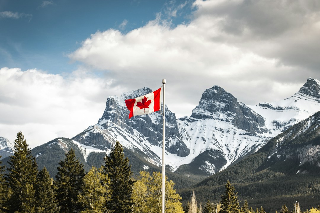 Canadian immigration application documents with Ontario flag representing OINP Workforce Priority Stream update