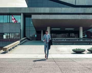 Businessman on business visitor visa of Canada coming out of the airport.