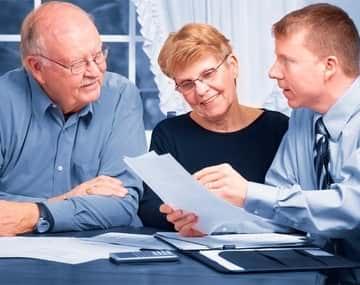 An immigration consultant is explaining the parents and grandparents sponsorship program to the parents